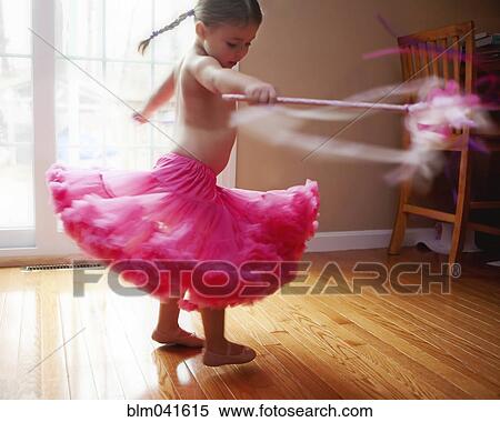 Stock Photography - Caucasian girl twirling in skirt. Fotosearch