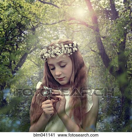 Caucasian girl wearing flower crown in forest View Large Photo Image Stock Image - Caucasian girl wearing flower crown in forest. Fotosearch