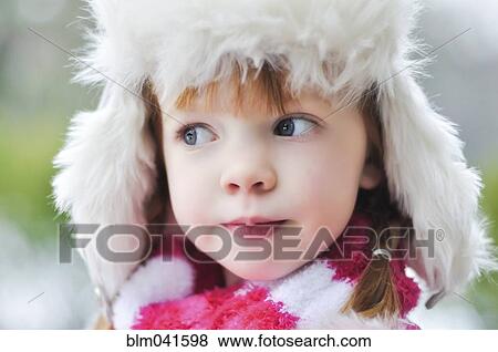 Caucasian girl wearing fuzzy hat outdoors View Large Photo Image Stock Photo - Caucasian girl wearing fuzzy hat outdoors. Fotosearch
