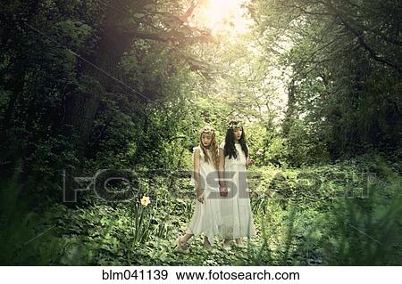 Stock Photo - Caucasian girls exploring garden. Fotosearch