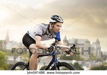 Caucasian man cycling outdoors View Large Photo Image Stock Photograph - Caucasian man cycling outdoors. Fotosearch
