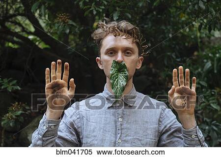 Caucasian man with dirty hands and leaf View Large Photo Image Stock Photography - Caucasian man with dirty hands and leaf. Fotosearch