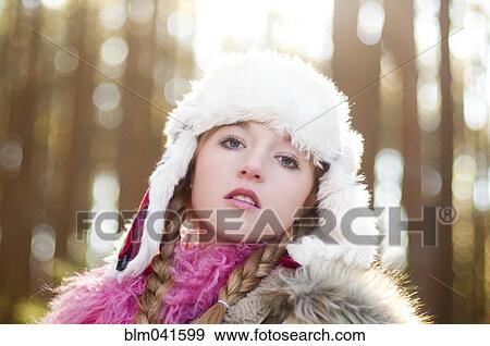 Caucasian teenage girl wearing fuzzy hat outdoors View Large Photo Image Stock Photo - Caucasian teenage girl wearing fuzzy hat outdoors. Fotosearch