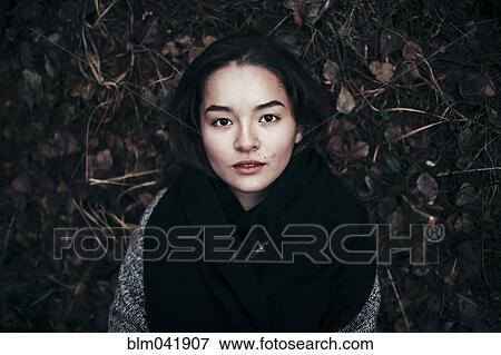Caucasian woman laying in dirt View Large Photo Image Stock Photo - Caucasian woman laying in dirt. Fotosearch