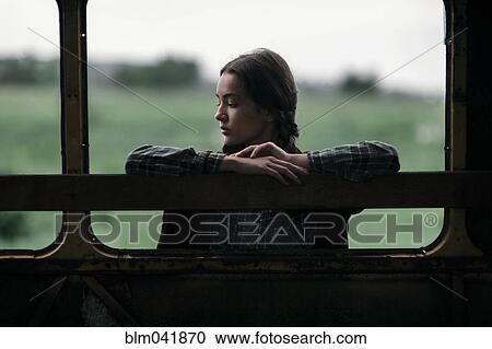 Caucasian woman leaning on empty bus View Large Photo Image Stock Image - Caucasian woman leaning on empty bus. Fotosearch