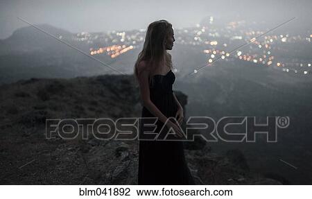 Caucasian woman on hilltop admiring cityscape view View Large Photo Image Stock Image - Caucasian woman on hilltop admiring cityscape view. Fotosearch