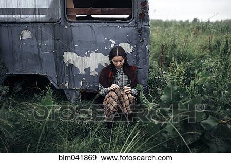 Caucasian woman sitting near antique truck View Large Photo Image Stock Photo - Caucasian woman sitting near antique truck. Fotosearch