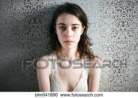 Caucasian woman standing at wallpaper View Large Photo Image Stock Image - Caucasian woman standing at wallpaper. Fotosearch