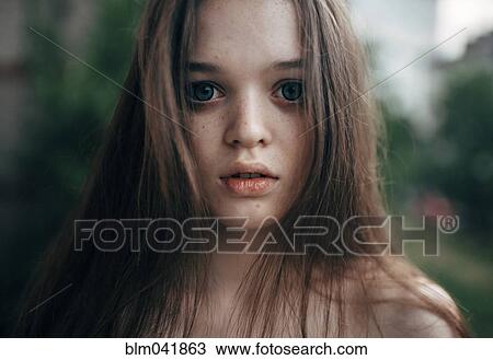 Stock Image - Caucasian woman standing outdoors. Fotosearch
