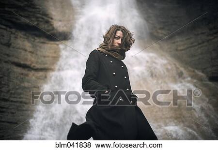 Caucasian woman standing under waterfall View Large Photo Image Stock Photo - Caucasian woman standing under waterfall. Fotosearch