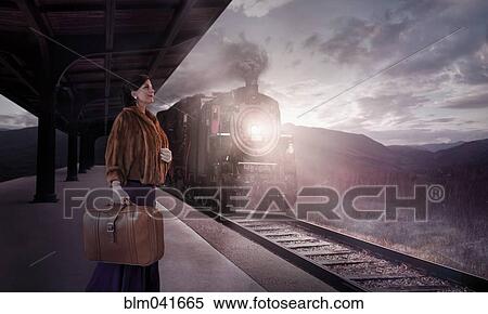 Stock Photography - Caucasian woman waiting in train station. Fotosearch