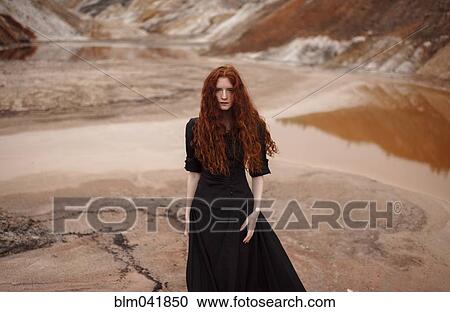 Caucasian woman walking in remote landscape View Large Photo Image Stock Image - Caucasian woman walking in remote landscape. Fotosearch