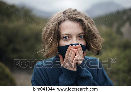 Caucasian woman wearing turtleneck sweater outdoors View Large Photo Image Picture - Caucasian woman wearing turtleneck sweater outdoors. Fotosearch