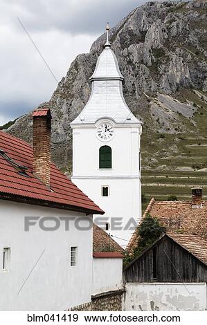 Church clock tower and mountains View Large Photo Image Stock Photo - Church clock tower and mountains. Fotosearch