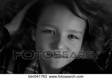 Stock Image - Close up of Caucasian girl smiling. Fotosearch