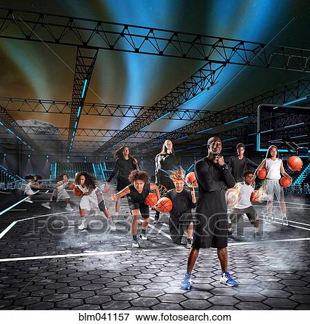 Stock Photo - Composite image of athletes playing basketball on court. Fotosearch