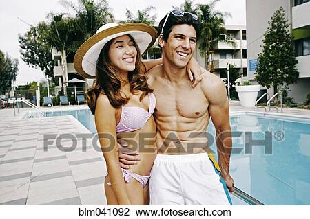 Couple hugging at swimming pool View Large Photo Image Stock Image - Couple hugging at swimming pool. Fotosearch