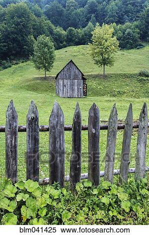 Dilapidated fence and barn in rural farm field View Large Photo Image Stock Photography - Dilapidated fence and barn in rural farm field. Fotosearch