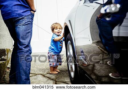 Stock Photography - Father and baby son washing car. Fotosearch