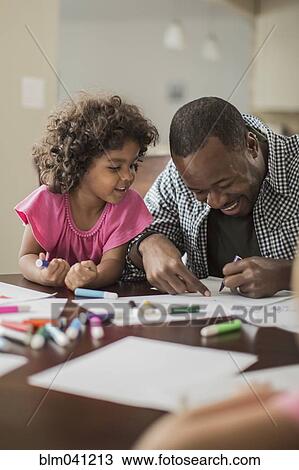 Father and daughter drawing in kitchen View Large Photo Image Stock Image - Father and daughter drawing in kitchen. Fotosearch