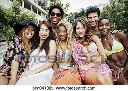 Stock Photography - Friends smiling outdoors. Fotosearch