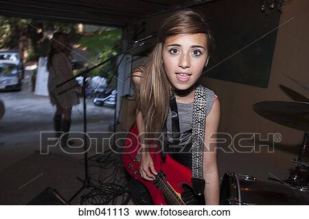 Girl playing guitar in rock band View Large Photo Image Stock Image - Girl playing guitar in rock band. Fotosearch