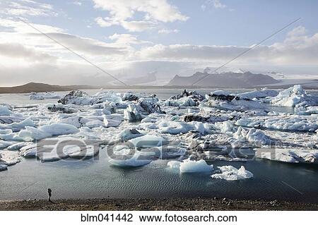 Glaciers floating near shore View Large Photo Image Stock Image - Glaciers floating near shore. Fotosearch