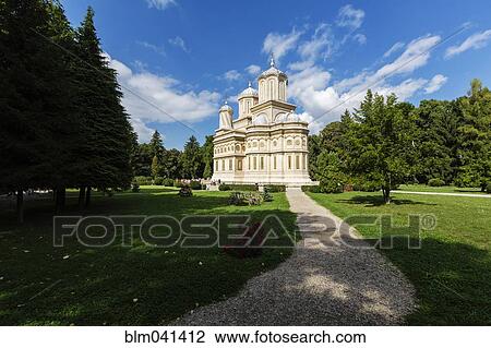 Stock Image - "Gravel path to Curtea de Arges monastery, Romania". Fotosearch