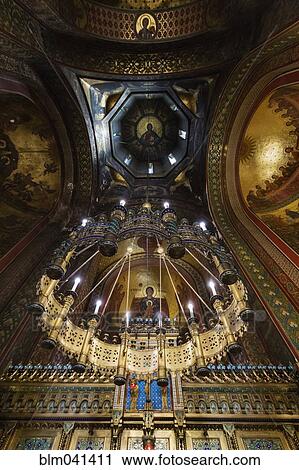 Stock Image - "Low angle view of ornate cathedral roof, Curtea de Arges, Romania". Fotosearch