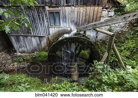 Mill wheel and waterway at dilapidated building View Large Photo Image Stock Image - Mill wheel and waterway at dilapidated building. Fotosearch