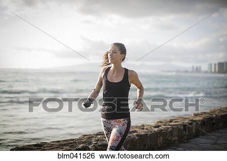 Mixed race amputee athlete jogging on urban waterfront View Large Photo Image Stock Photograph - Mixed race amputee athlete jogging on urban waterfront. Fotosearch