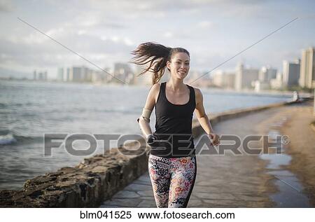 Mixed race amputee athlete jogging on urban waterfront View Large Photo Image Stock Photography - Mixed race amputee athlete jogging on urban waterfront. Fotosearch