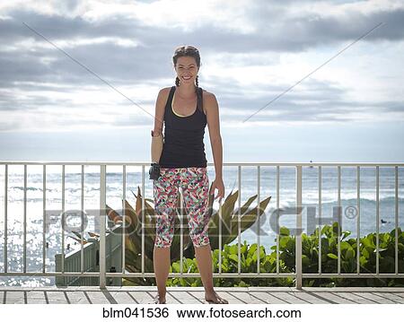 Mixed race amputee athlete smiling on balcony View Large Photo Image Stock Photograph - Mixed race amputee athlete smiling on balcony. Fotosearch