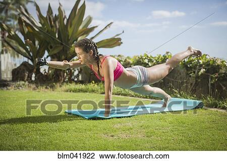 Mixed race amputee practicing yoga in grass View Large Photo Image Stock Image - Mixed race amputee practicing yoga in grass. Fotosearch