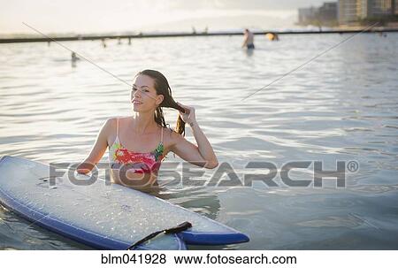 Mixed race amputee with surfboard in ocean View Large Photo Image Stock Photo - Mixed race amputee with surfboard in ocean. Fotosearch