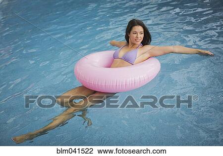 Mixed race amputee woman swimming in pool View Large Photo Image Stock Image - Mixed race amputee woman swimming in pool. Fotosearch