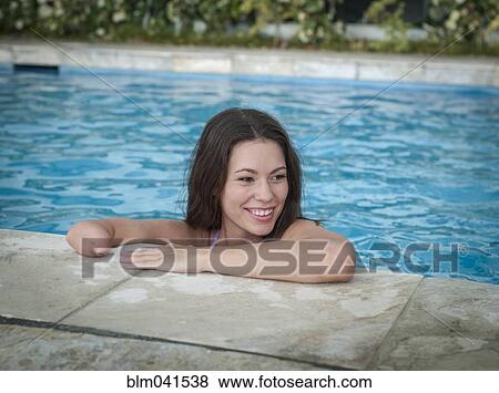 Mixed race amputee woman swimming in pool View Large Photo Image Stock Photo - Mixed race amputee woman swimming in pool. Fotosearch