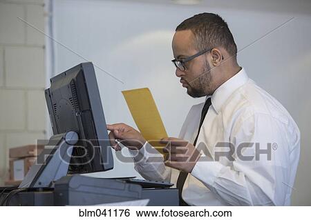 Stock Photograph - Mixed race server with down syndrome entering order in restaurant. Fotosearch