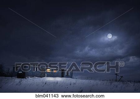 Stock Image - Moon over trailer house in snowy yard. Fotosearch