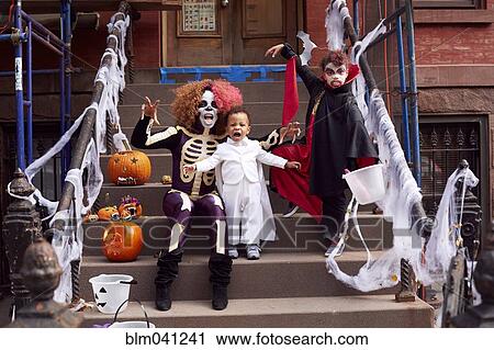 Mother and children wearing Halloween costumes View Large Photo Image Stock Image - Mother and children wearing Halloween costumes. Fotosearch