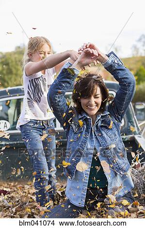Picture - Mother and daughter playing in truck bed. Fotosearch