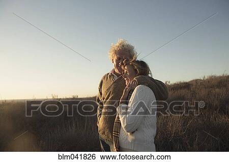 Older Caucasian couple hugging outdoors View Large Photo Image Stock Photograph - Older Caucasian couple hugging outdoors. Fotosearch