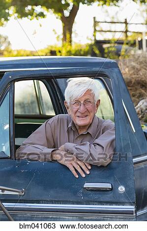 Older Caucasian man sitting in truck View Large Photo Image Stock Image - Older Caucasian man sitting in truck. Fotosearch