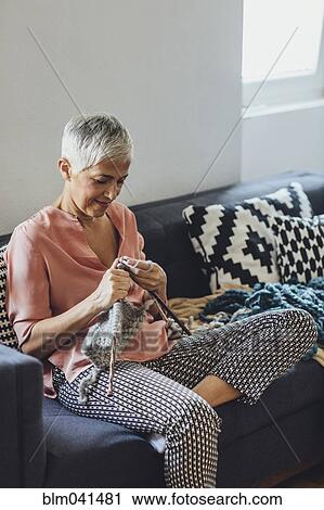 Older Caucasian woman knitting on sofa View Large Photo Image Stock Image - Older Caucasian woman knitting on sofa. Fotosearch
