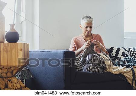 Older Caucasian woman knitting on sofa View Large Photo Image Stock Image - Older Caucasian woman knitting on sofa. Fotosearch