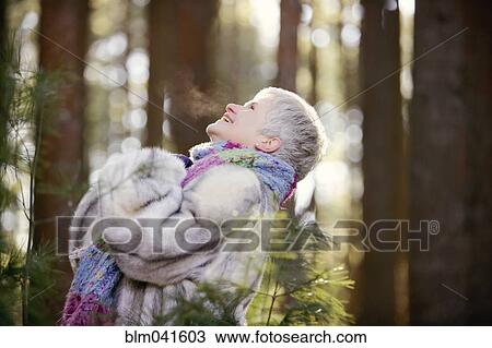 Older Caucasian woman standing outdoors View Large Photo Image Stock Image - Older Caucasian woman standing outdoors. Fotosearch