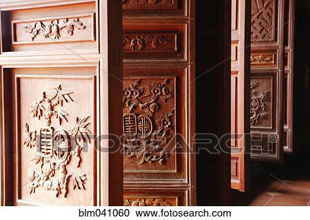 Ornate doors carved with traditional emblems View Large Photo Image Stock Image - Ornate doors carved with traditional emblems. Fotosearch