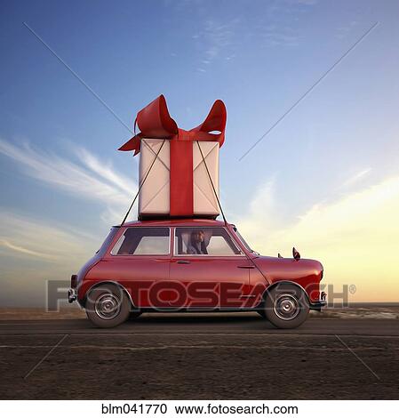 Stock Image - Pacific Islander woman hauling gift on car. Fotosearch