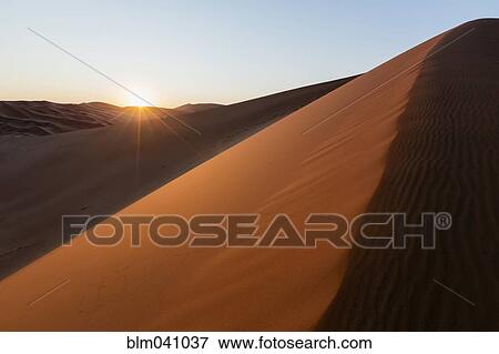 Stock Photo - Sand dunes in remote desert. Fotosearch