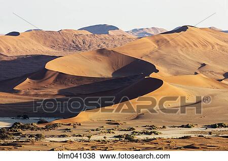 Sand dunes in remote desert View Large Photo Image Stock Photo - Sand dunes in remote desert. Fotosearch